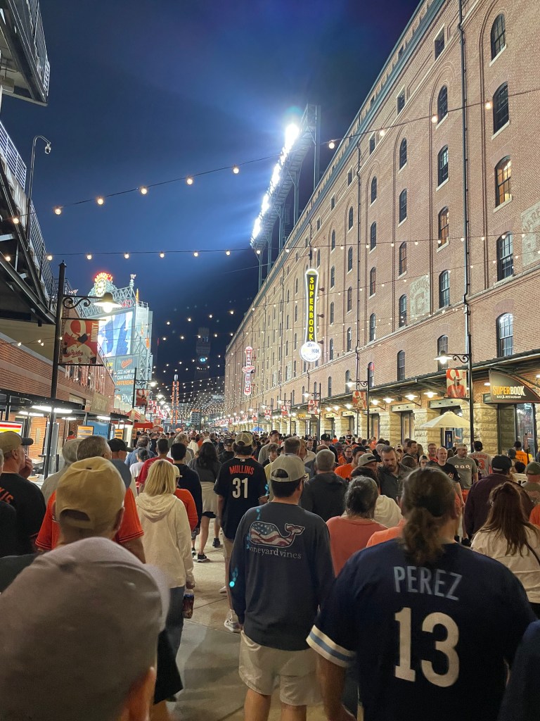 Crowd leaving ballpark after a night game.