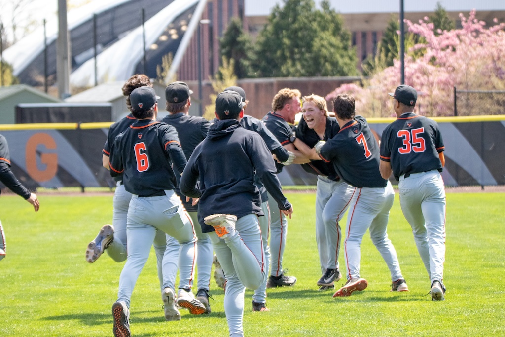 More players mob the batter.