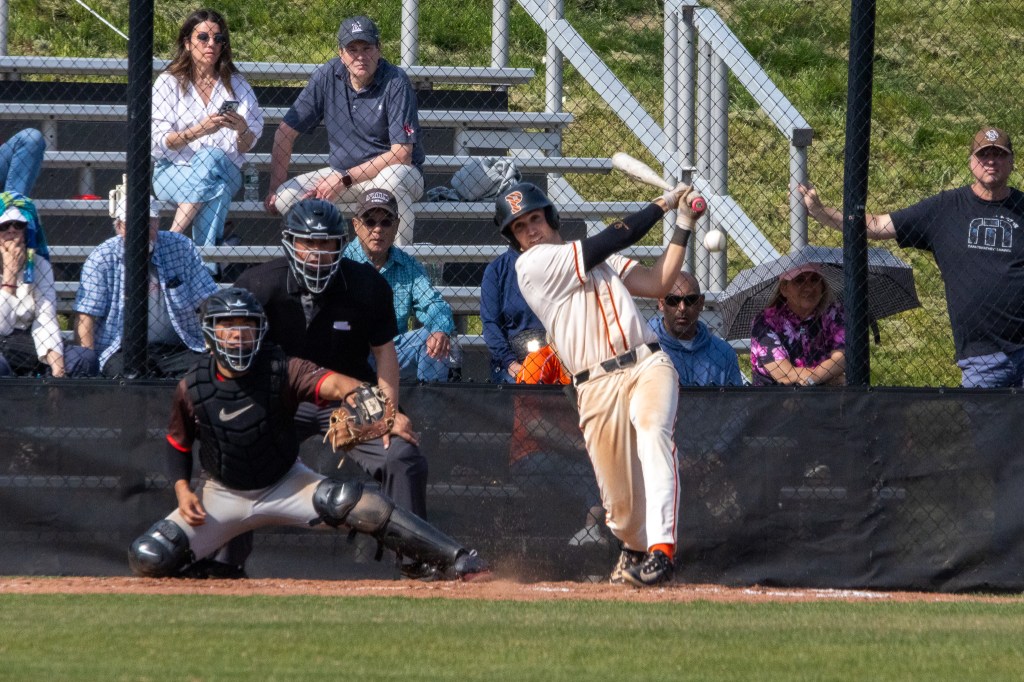 A Princeton batter (I can't tell who) drives a ball into the outfield.
