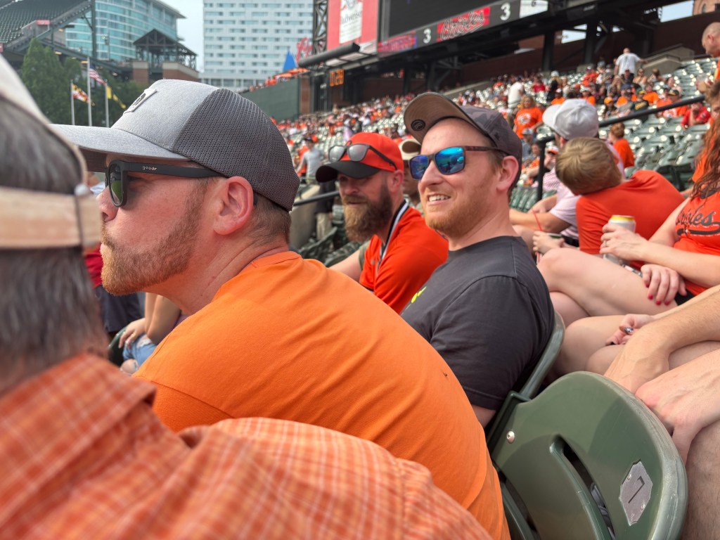 Side view of my son and nephews in the right field stands, near the main scoreboard at Oriole Park.