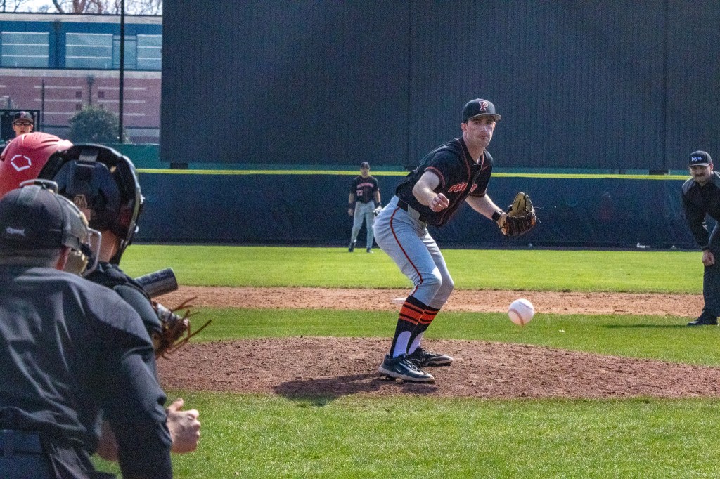 Princeton pitcher watches as his pitch to a right-handed batter tails away to the outside.
