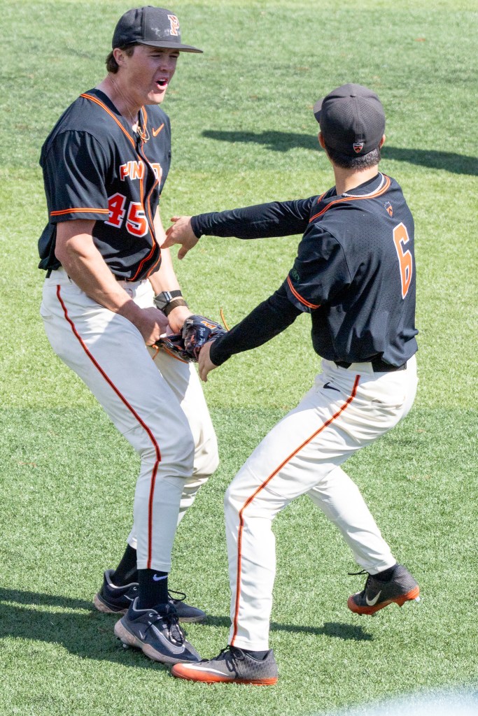 Princeton two pitchers gleefully greet one another after the reliever got the last out.
